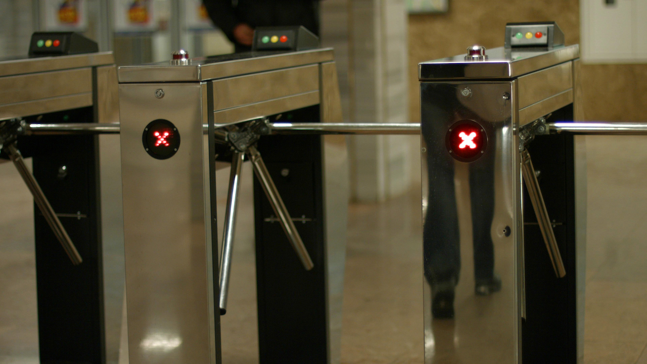 Public transport access gates representing depot visitor and staff access control